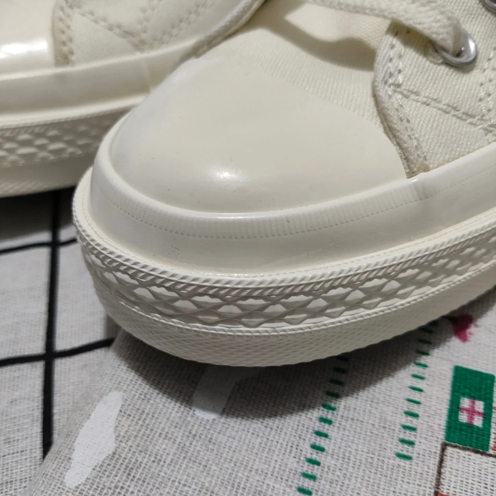 Comme des Garçons PLAY Cream Slip-On Sneakers with Red Heart Logo